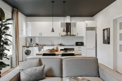 a bedroom with a wooden closet and a bed at Dorria - 3 bedrooms in Eixample Dreta in Barcelona