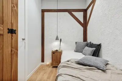 a bedroom with a bed with a hat on it at Dorria - 3 bedrooms in Eixample Dreta in Barcelona