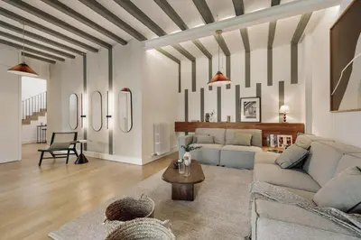 a dining room with a wooden table and chairs at Damat - 4 bedrooms and terrace in Sarrià in Barcelona