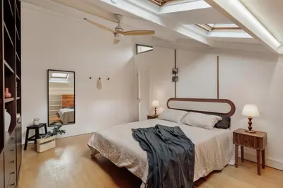 a bedroom with a bed and a desk in it at Damat - 4 bedrooms and terrace in Sarrià in Barcelona