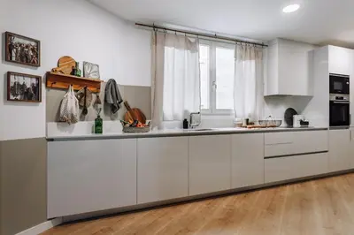 a bedroom with a bed and a mirror on the wall at Arjona - 3 bedrooms in Eixample Dreta in Barcelona