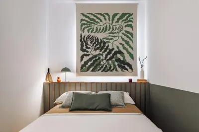 a table with two candles on top of a table at Arjona - 3 bedrooms in Eixample Dreta in Barcelona
