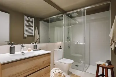 a bedroom with a bed with a window and a blanket at Arjona - 3 bedrooms in Eixample Dreta in Barcelona