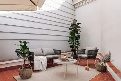 a living room with a couch and a table at Arjona - 3 bedrooms in Eixample Dreta in Barcelona