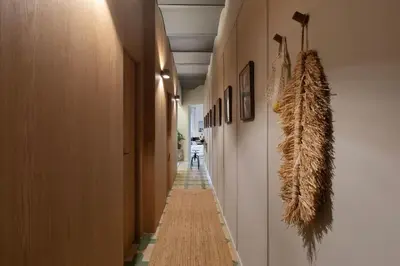a living room with a couch and a plant at Muari - 2 bedrooms in Eixample Esquerra in Barcelona