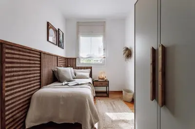 a bedroom with a bed and a mirror at Cazalla - 2 bedrooms and office in Gràcia in Barcelona