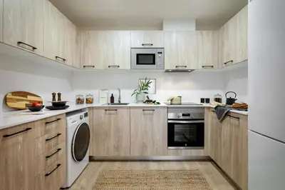 a living room with a white couch and a table at Aino - 2 bedrooms and balcony in Eixample Esquerra in Barcelona