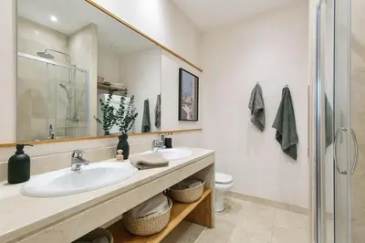 a bedroom with two beds and a painting on the wall at Nerano - 2 bedrooms and terrace in Gràcia in Barcelona