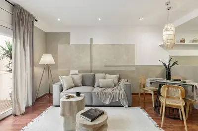 a desk with a computer on it with a chair at Nerano - 2 bedrooms and terrace in Gràcia in Barcelona