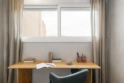 a table and chairs with a bowl of fruit on it at Nerano - 2 bedrooms and terrace in Gràcia in Barcelona