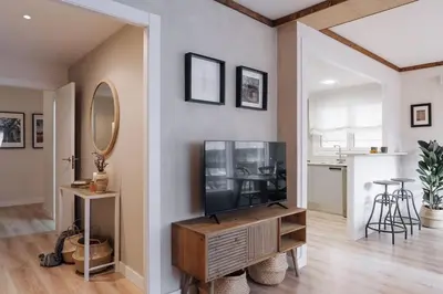 a living room with a table and a kitchen at Nava - 3 bedrooms in Sant Gervasi in Barcelona