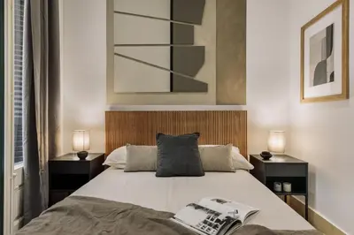 a living room with a couch and a table at Uru - 2 bedrooms and balcony in Vila de Gràcia in Barcelona