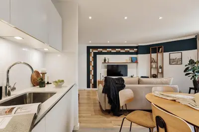 a mirror on a wooden table in a hallway at Levent - 3 bedrooms and terrace in Sant Antoni in Barcelona
