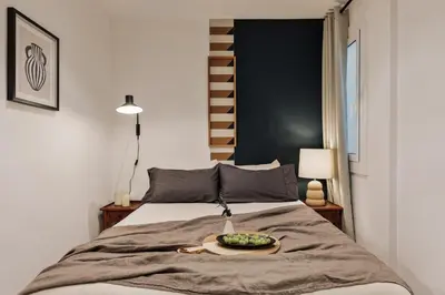 a bedroom with a bed and a television at Levent - 3 bedrooms and terrace in Sant Antoni in Barcelona
