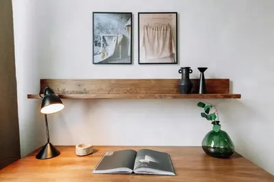 a kitchen with a wooden table and white cabinets at Furore - 1 bedroom in Eixample Esquerra in Barcelona