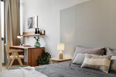 a kitchen with a wooden table with a bowl of fruit at Furore - 1 bedroom in Eixample Esquerra in Barcelona