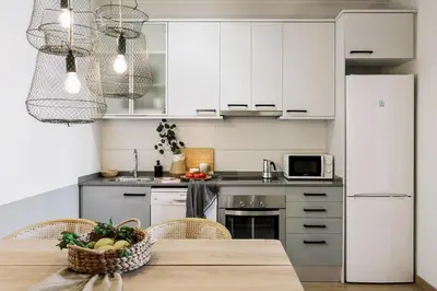 a desk with a lamp and a chair in a room at Furore - 1 bedroom in Eixample Esquerra in Barcelona