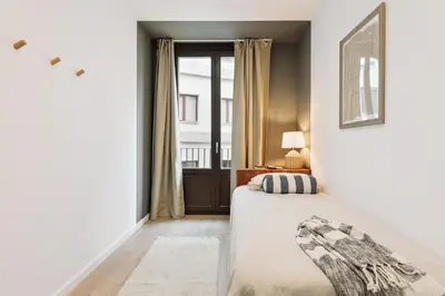 a living room with a couch and a table at Cava - 2 bedrooms and terrace in Ciutat Vella in Barcelona