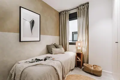 a living room with a table and a couch at Cadiar - 2 bedrooms in Eixample Esquerra in Barcelona