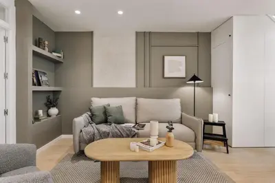 a kitchen with green cabinets and a table and chairs at Monterrico - 2 bedrooms and terrace in Gràcia in Barcelona