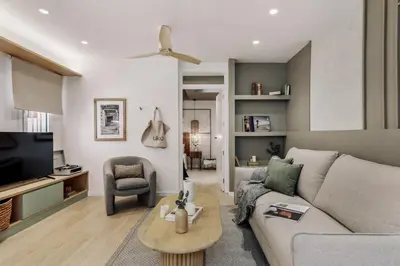 a dining room with a table and a staircase at Monterrico - 2 bedrooms and terrace in Gràcia in Barcelona
