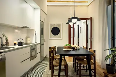 a living room with a couch and a brick wall at Kasa - 2 bedrooms in Ciutat Vella in Barcelona