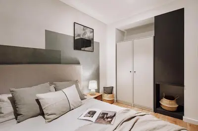 a bedroom with a bed with a glass wall at Lescun - 2 bedrooms in Eixample Esquerra in Barcelona