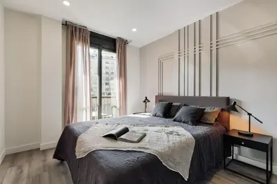a bathroom with a sink and a glass shower at Tortosa - 3 bedrooms and a terrace in Les Corts in Barcelona