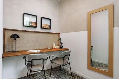 a bedroom with a bed with a metal headboard at Seron - 3 bedrooms and office in Eixample Esquerra in Barcelona