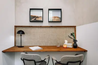 a dining room with a table and a couch at Seron - 3 bedrooms and office in Eixample Esquerra in Barcelona