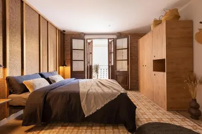 a living room with a couch and a table at Amandi - 2 bedrooms in Gràcia in Barcelona