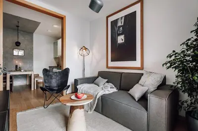 an office with a wooden table and a window at Biescas - 1 bedroom in Eixample Esquerra in Barcelona