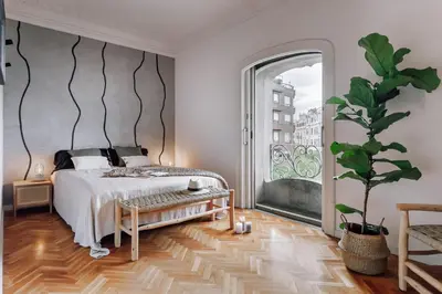 a white bedroom with a desk and a bed at Olvera - 3 bedrooms in Eixample Dreta in Barcelona