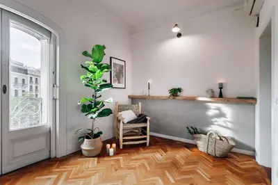 a kitchen with a refrigerator and a washing machine at Olvera - 3 bedrooms in Eixample Dreta in Barcelona