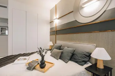 a kitchen with white cabinets and a counter top at Haring - 2 bedrooms in Gràcia in Barcelona