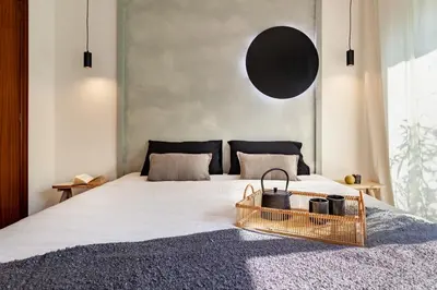 a bedroom with a bed with a green blanket at Mitaka - 3 bedrooms and terrace in Eixample Dreta in Barcelona