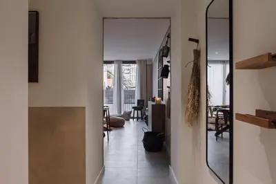 a candle sitting on top of a wooden table at Pedrera - 2 bedrooms in Eixample Esquerra in Barcelona