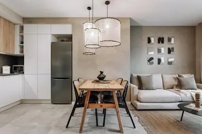 a living room with a white couch and a table at Mont - 2 bedrooms and office in Eixample Esquerra in Barcelona