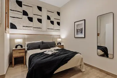 a living room with a couch and a tv at Kaax - 3 bedrooms and balcony in Eixample in Barcelona