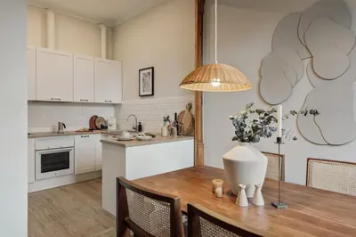 a room with a desk with a chair and a lamp at Kaax - 3 bedrooms and balcony in Eixample in Barcelona