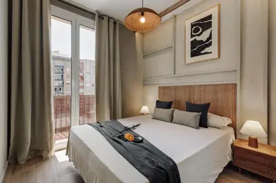 a bathroom with a shower and a bed and a mirror at Atitlan - 3 bedrooms, office and balcony in Eixample Esquerra in Barcelona
