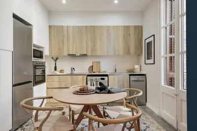 a living room with a couch and a table at Cira - 2 bedrooms and balcony in Vila de Gràcia in Barcelona