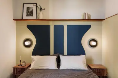 a bedroom with a bed and a large window at Cira - 2 bedrooms and balcony in Vila de Gràcia in Barcelona