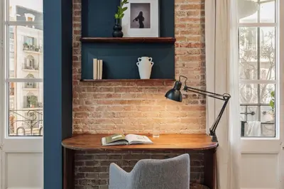 a living room with a couch and a table at Cira - 2 bedrooms and balcony in Vila de Gràcia in Barcelona
