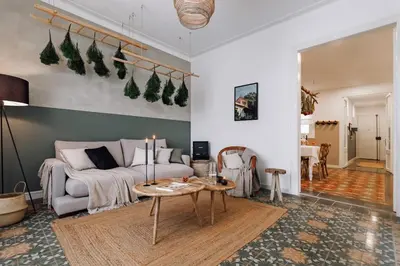 a kitchen with a table and chairs in a kitchen at Baeza - 2 bedrooms and office in Eixample Esquerra in Barcelona