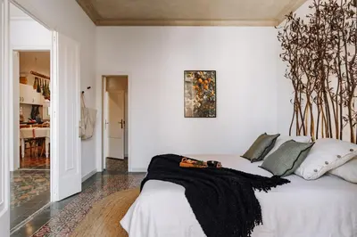 a desk with a computer and a chair in a room at Baeza - 2 bedrooms and office in Eixample Esquerra in Barcelona