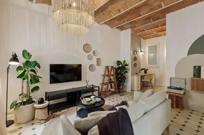 a bedroom with a bed and a desk and a chair at Cape - 2 bedrooms in Gràcia in Barcelona
