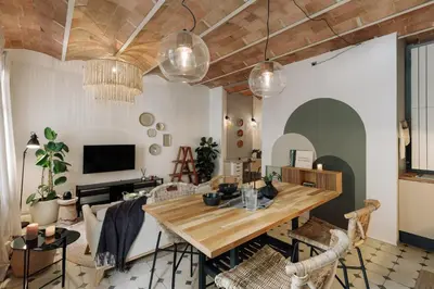 a living room with a couch and a tv at Cape - 2 bedrooms in Gràcia in Barcelona