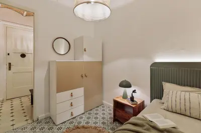 a bedroom with a bed and a dresser and a mirror at Cape - 2 bedrooms in Gràcia in Barcelona
