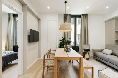a bedroom with a bed with books on it at Batipaglia - 2 bedrooms and terrace in Ciutat Vella in Barcelona